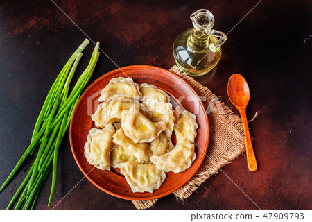 The boiled made dumplings with a stuffing  47909793