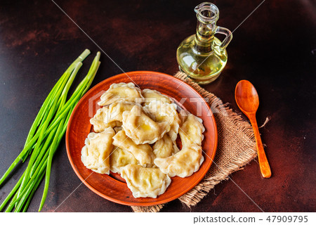 The boiled made dumplings with a stuffing  47909795