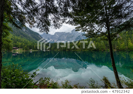 Fusine lake and Alps - Friuli Venezia Giulia Italy Fusine lake and Alps - Friuli Venezia Giulia Italy 47912342