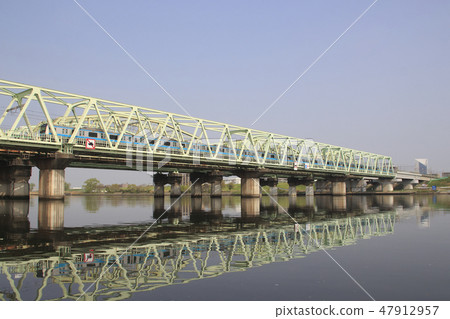 Keihin Tohoku Line E233 train crossing the Arakawa bridge 47912957