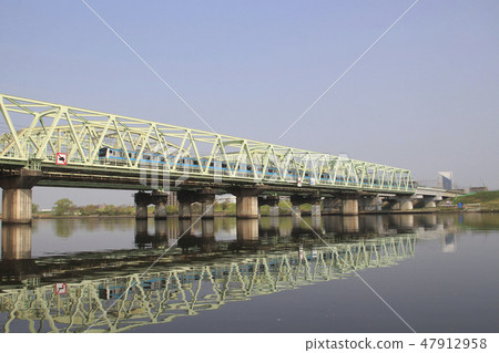 Keihin Tohoku Line E233 train crossing the Arakawa bridge 47912958