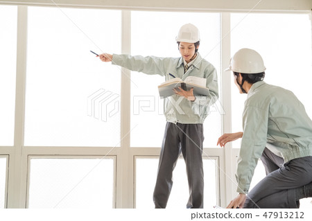 Apply for construction confirmation with architectural confirmation application Male surveyor of helmets who pointed out and confirm measurement drawing and site dimension in helmet Patient engineer Apply for construction confirmation with architectural confirmation application Male surveyor of helmets who pointed out and confirm measurement drawing and site dimension in helmet Patient engineer 47913212