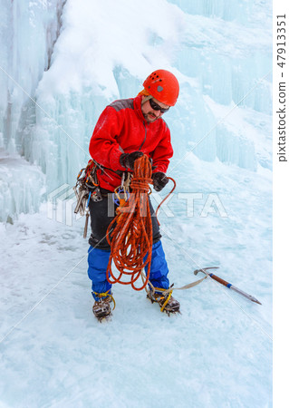 mountaineer standing under the glacier mountaineer standing under the glacier 47913351