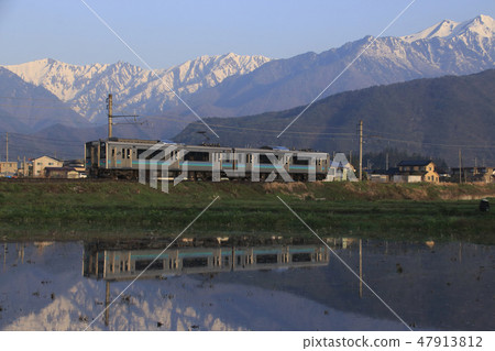 Northern Alps fringes of melting snow and Otsuki Line E127 series Northern Alps fringes of melting snow and Otsuki Line E127 series 47913812
