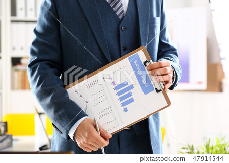 Male arm in suit show stats graphic clipped to pad Male arm in suit show stats graphic clipped to pad 47914544
