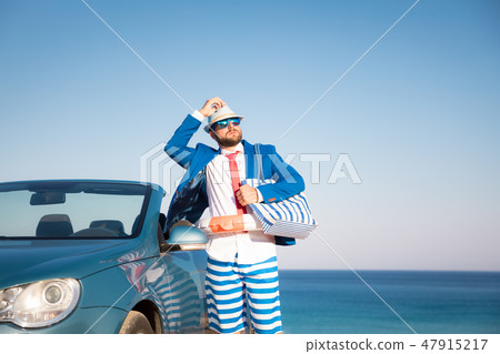 Successful young businessman on a beach 47915217