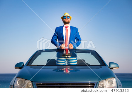 Successful young businessman on a beach 47915223