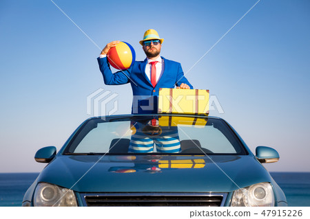 Successful young businessman on a beach 47915226