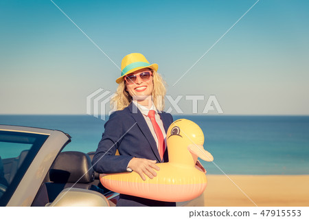Successful young businesswoman on a beach 47915553