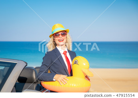 Successful young businesswoman on a beach 47915554