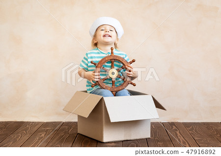Happy child playing at home Happy child playing at home 47916892