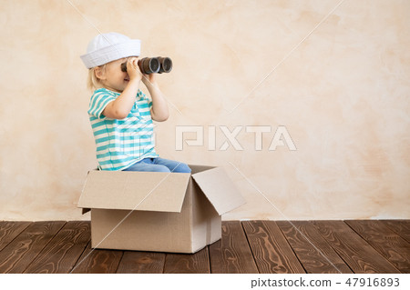 Happy child playing at home Happy child playing at home 47916893