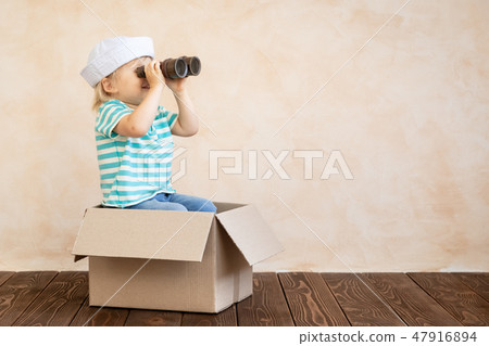 Happy child playing at home Happy child playing at home 47916894
