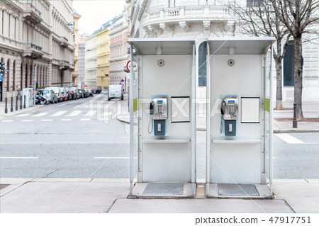 Pair of payphone booth in Vienna center street. Two modern public phones on european city street Pair of payphone booth in Vienna center street. Two modern public phones on european city street 47917751