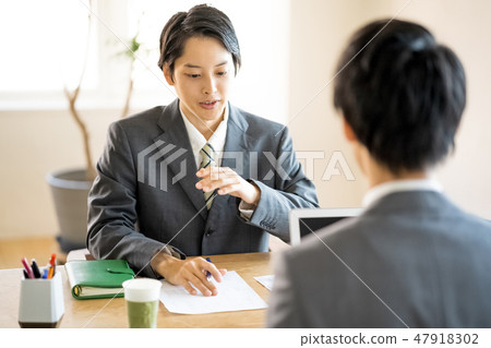 Young men who explain corporate projects with serious looking Sales Sales people Employee personnel Personnel representative Young men who explain corporate projects with serious looking Sales Sales people Employee personnel Personnel representative 47918302