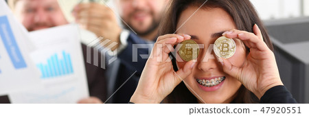 Young happy smiling chinese woman holding 47920551