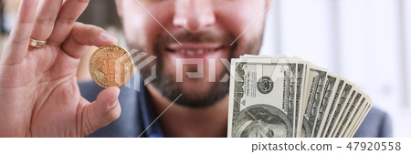 Young happy smiling businessman holding Young happy smiling businessman holding 47920558