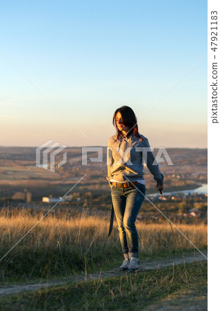 Girl on a high mountain trains with a machete Girl on a high mountain trains with a machete 47921183