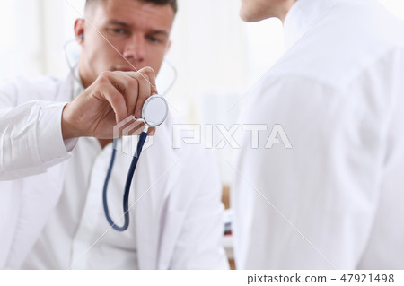 Handsome serious male doctor hold 47921498