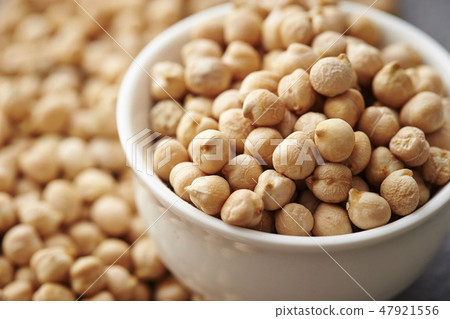 Chickpeas garbanzo gray background in a white vessel Chickpeas garbanzo gray background in a white vessel 47921556