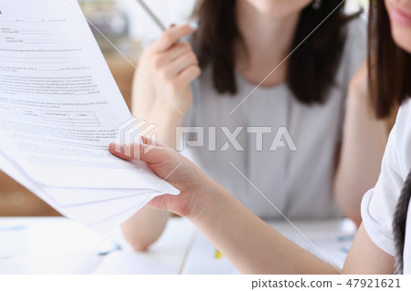 Group of people deliberate on problem with 47921621