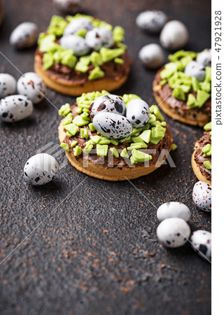 Easter cookies in shape of nest with eggs Easter cookies in shape of nest with eggs 47921928