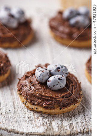 Easter cookies in shape of nest with eggs Easter cookies in shape of nest with eggs 47921929