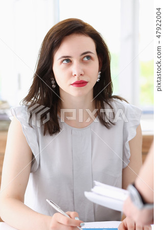 Female employee show pack of documents 47922004