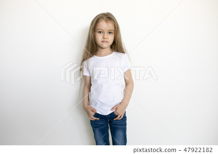 Cute little girl in white t-shirt. Mock-up. Cute little girl in white t-shirt. Mock-up. 47922182