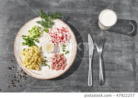 Okroshka - Traditional Russian cold summer soup with vegetables, ham and herbs, dressed with kefir 47922257