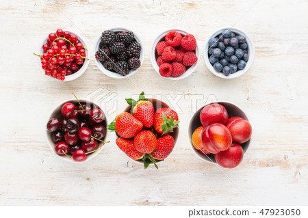 Mixed berries in bowls 47923050