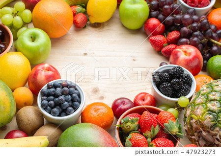 Rainbow fruits background 47923273