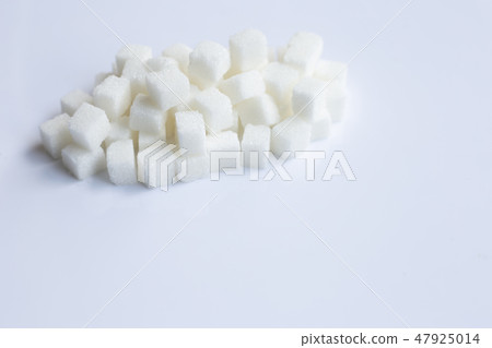Sugar cubes on white background Sugar cubes on white background 47925014