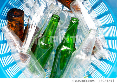 Glass bottles in waste basket. Glass bottles in waste basket. 47925251