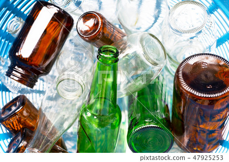 Glass bottles in waste basket. Glass bottles in waste basket. 47925253