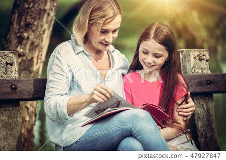 Happy mother and little kid daughter in park. Happy mother and little kid daughter in park. 47927847
