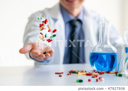 Medicine pills and tablets in research lab. Medicine pills and tablets in research lab. 47927936