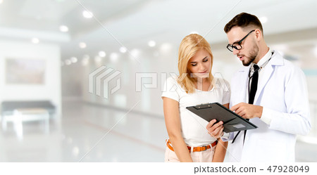 Doctor talking to patient in the hospital. 47928049