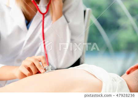 Woman Doctor and Male Patient in Hospital Office Woman Doctor and Male Patient in Hospital Office 47928236