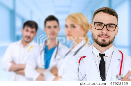 Doctor working in hospital with other doctors. 47928569