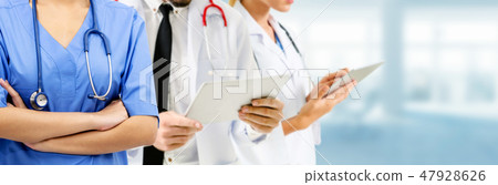 Doctor working in hospital with other doctors. Doctor working in hospital with other doctors. 47928626