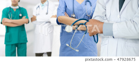 Doctor working in hospital with other doctors. Doctor working in hospital with other doctors. 47928675