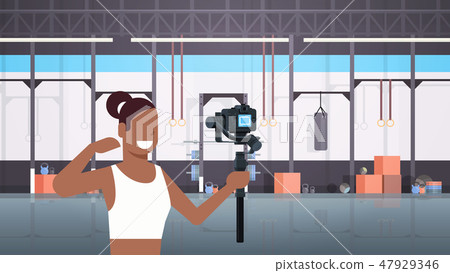 woman fitness blogger shooting selfie video african american girl in front of camera recording woman fitness blogger shooting selfie video african american girl in front of camera recording 47929346