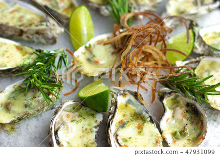 Seafood background. Oysters baked with cheese on plate. Mediterranean cuisine with seafood. Food 47931099