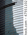 Glass window office building in modern city. Glass facade business skyscraper in urban architecture 47931102