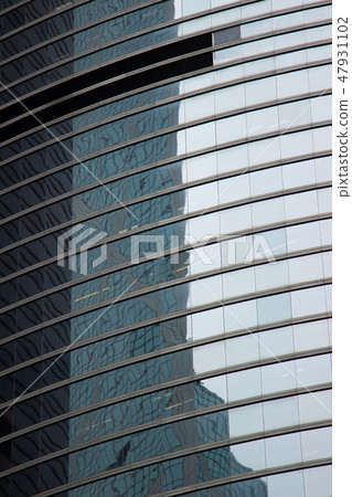 Glass window office building in modern city. Glass facade business skyscraper in urban architecture Glass window office building in modern city. Glass facade business skyscraper in urban architecture 47931102