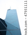 Office building with glass window on facade in urban architecture big city. Bottom view glass 47931111