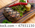 Barbecue meat steak with red hot pepper, herb, corn and tomato sauce on wooden board. Grilled steak 47931130