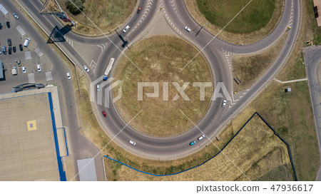 Aerial view of transport junction, traffic cross road junction day view from above with circle road. 47936617
