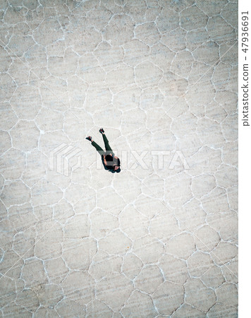 Man flyind a drone in Uyuni Bolivia 47936691